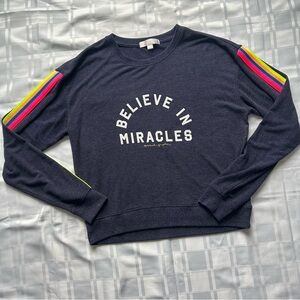 Spiritual Gangster Blue “Believe in Miracles” Sweater with Rainbow Stripes